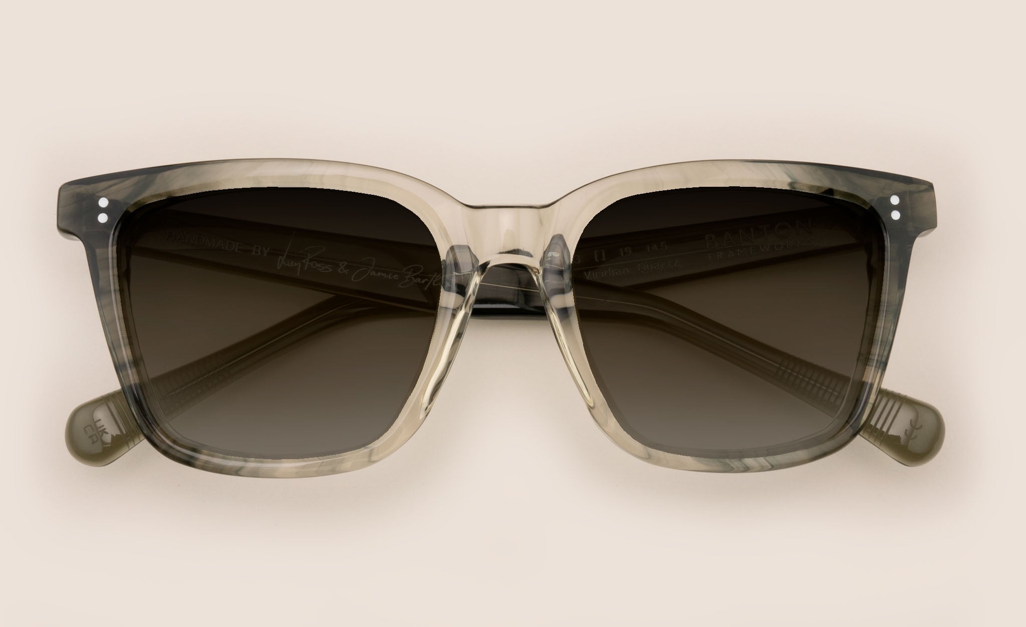 Front view of square crystal and green sunglasses frame