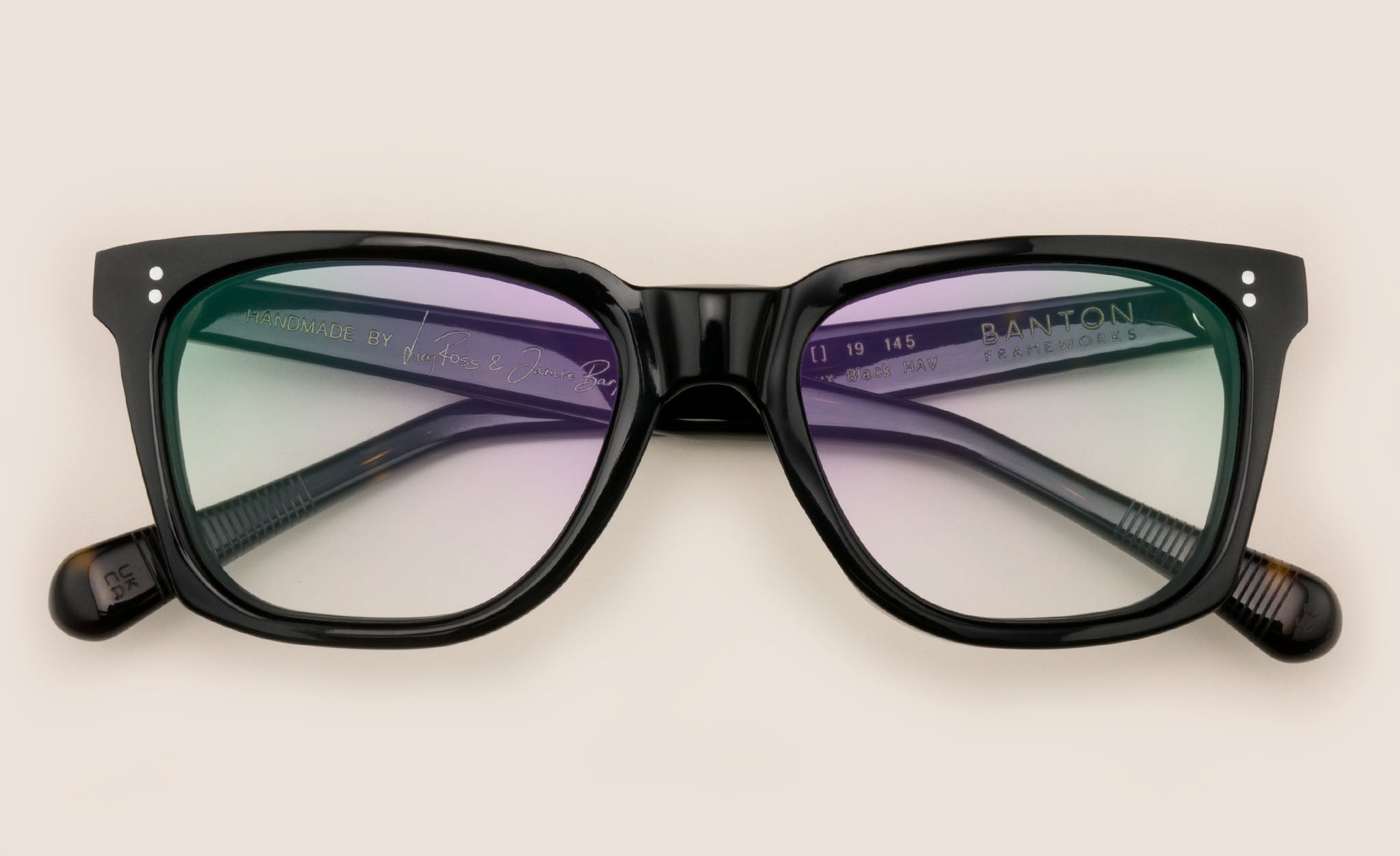 Rectangular black spectacles with Havana pattern temple arms