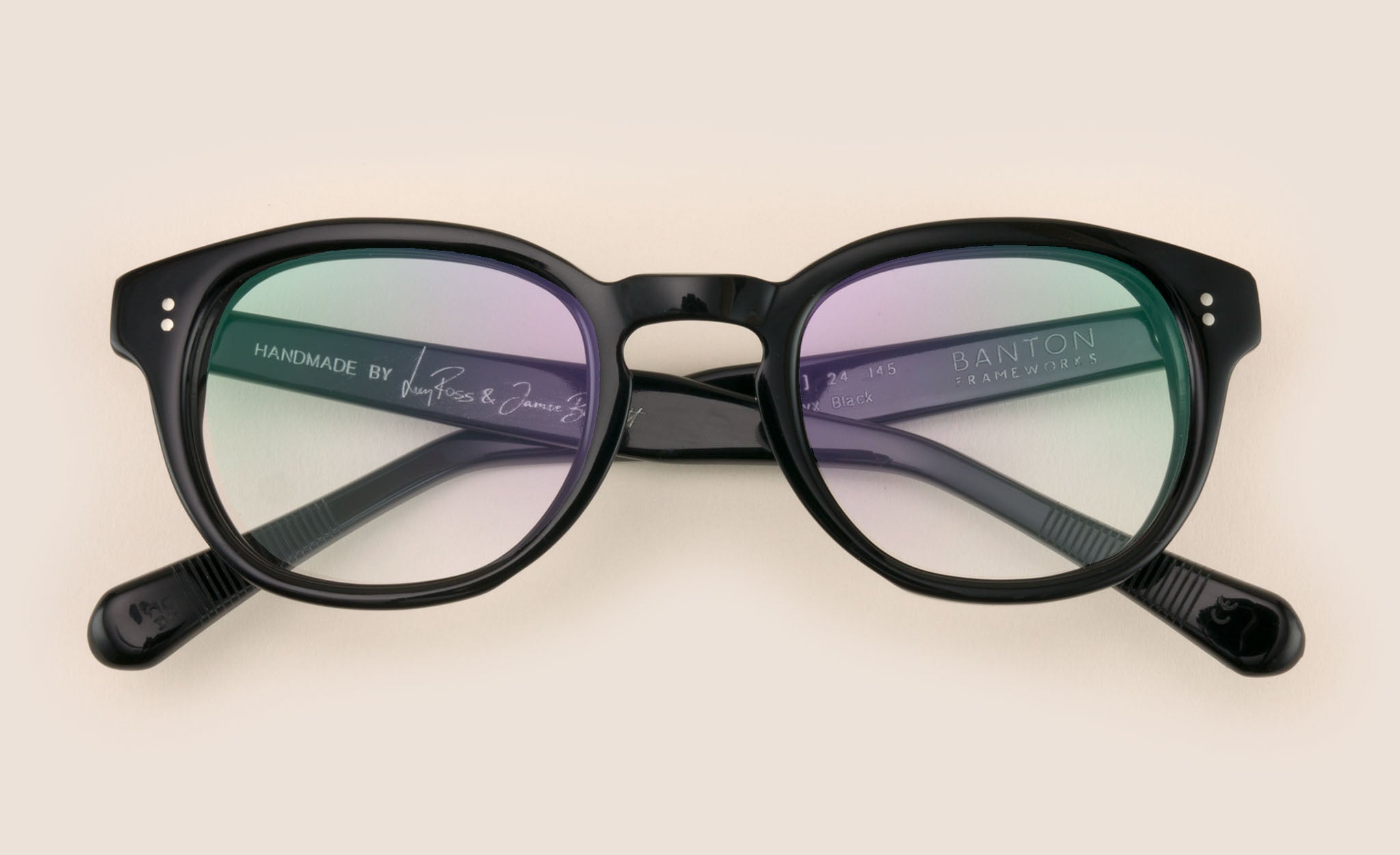 Chunky oval shaped back spectacles lying folded