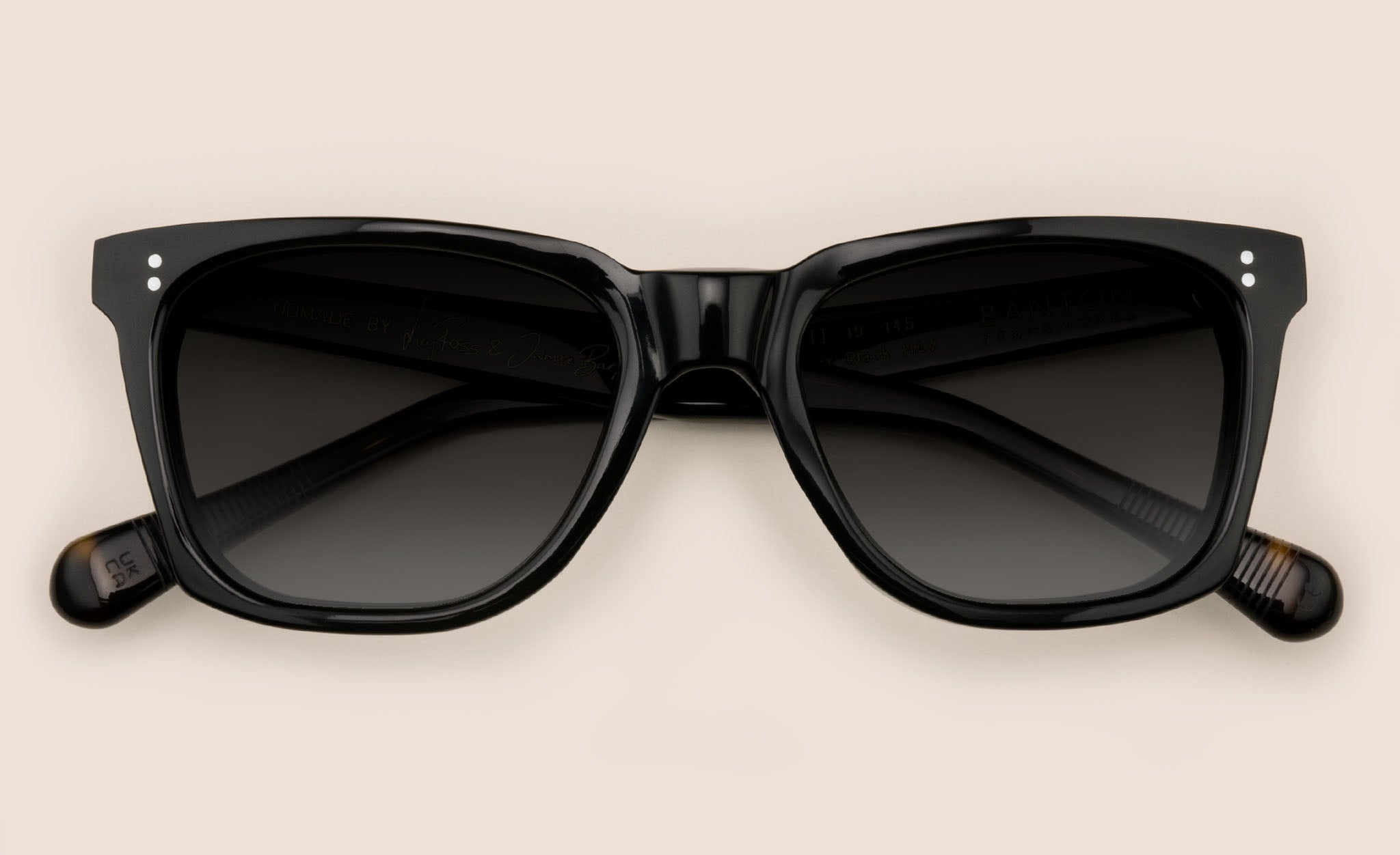 Rectangular sunglasses frame with dark grey lenses